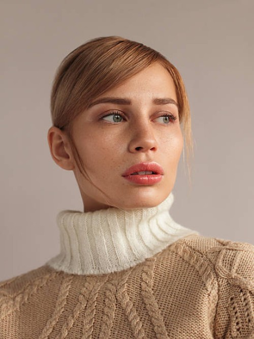 young beautiful woman in knitwear - fashion stock pictures, royalty-free photos & images