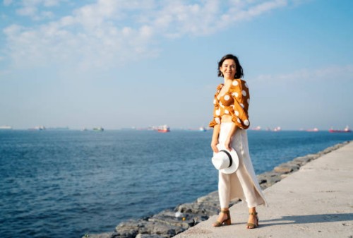 young beautiful woman posing by the sea, istanbul, turkey - fashion stock pictures, royalty-free photos & images