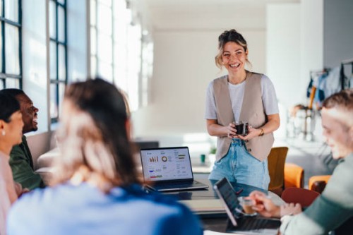 young business professionals working in a bright co-working space - fashion stock pictures, royalty-free photos & images