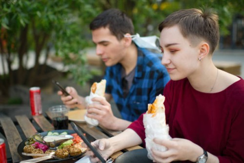 young couple in a cafe - junk food stock pictures, royalty-free photos & images