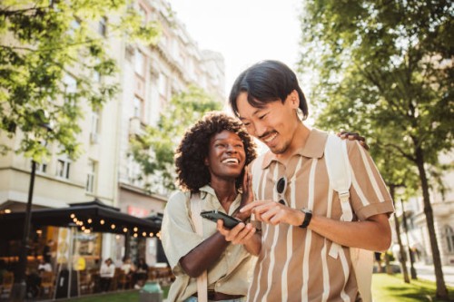 young couple in european city - travel stock-fotos und bilder