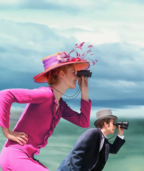 young couple in formal wear looking through binoculars outdoors - fashion stock pictures, royalty-free photos & images