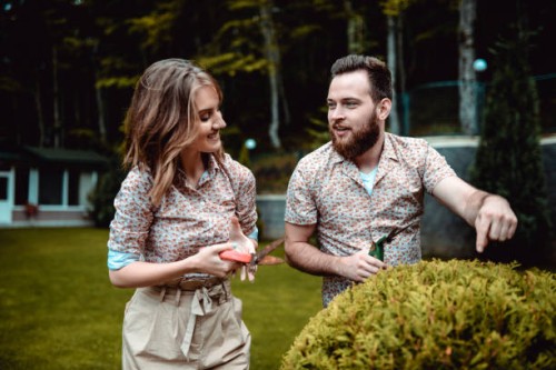 young couple learning about horticulture - garden decoration stock pictures, royalty-free photos & images