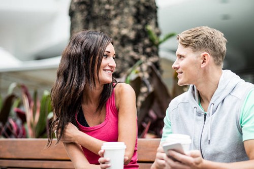 young couple looking some pictures on social networks - junk food stock pictures, royalty-free photos & images