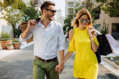 young couple shopping in the city - fashion stock pictures, royalty-free photos & images