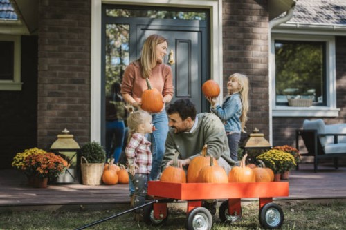 young family preparing for halloween - garden decoration stock pictures, royalty-free photos & images