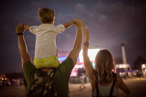 young family with son on street fair. - concert stock pictures, royalty-free photos & images
