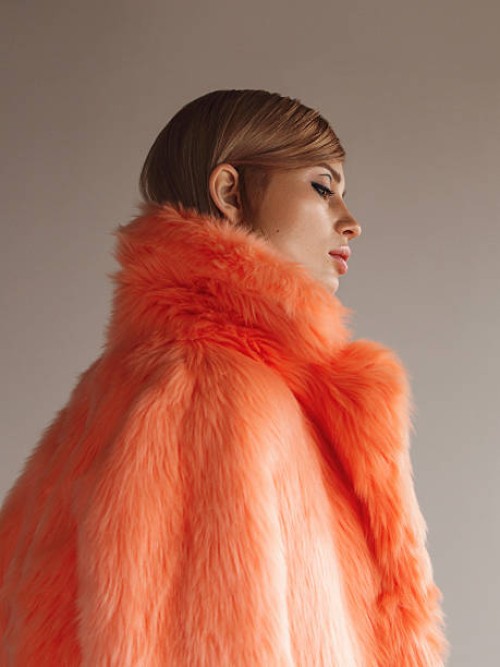 young fashionable woman in winter coat - fashion stock pictures, royalty-free photos & images