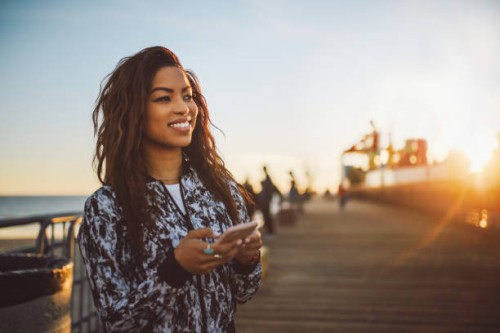 young fashionable woman texting on her phone in santa monica, la - fashion stock pictures, royalty-free photos & images