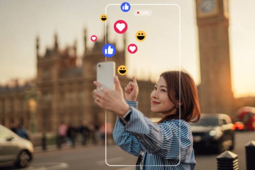 young female influencer live streaming with smartphone on social media while travelling - travel stock pictures, royalty-free photos & images
