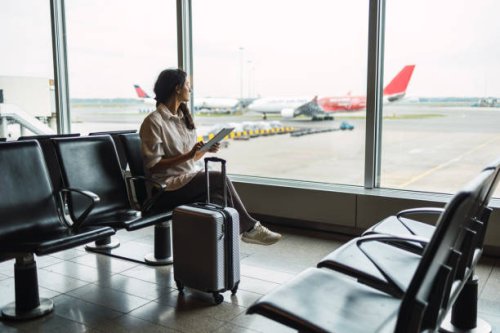 young female passenger waiting for flight at airport lounge - travel stock pictures, royalty-free photos & images
