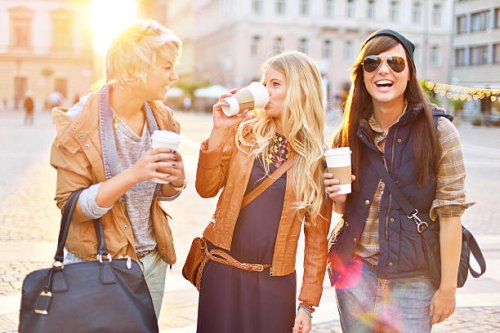 young friends together drinking coffee in the city - junk food stock pictures, royalty-free photos & images