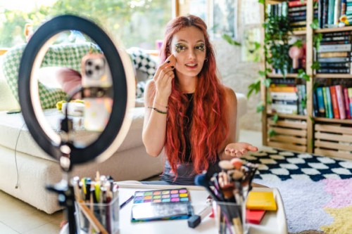young girl using social media shoots makeup video in her room - fashion stock pictures, royalty-free photos & images
