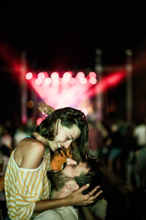 young happy couple having fun on music concert. - concert stock pictures, royalty-free photos & images