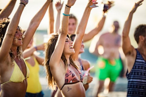 young happy people having fun with raised arms on a party in summer day. - concert stock pictures, royalty-free photos & images