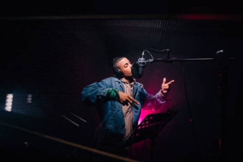 young hipster african-american rapper recording songs in music recording studio - fashion stock pictures, royalty-free photos & images