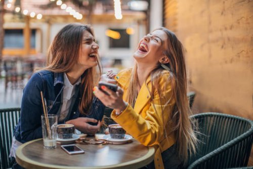 young ladies gossiping in cafe - coffee stock pictures, royalty-free photos & images