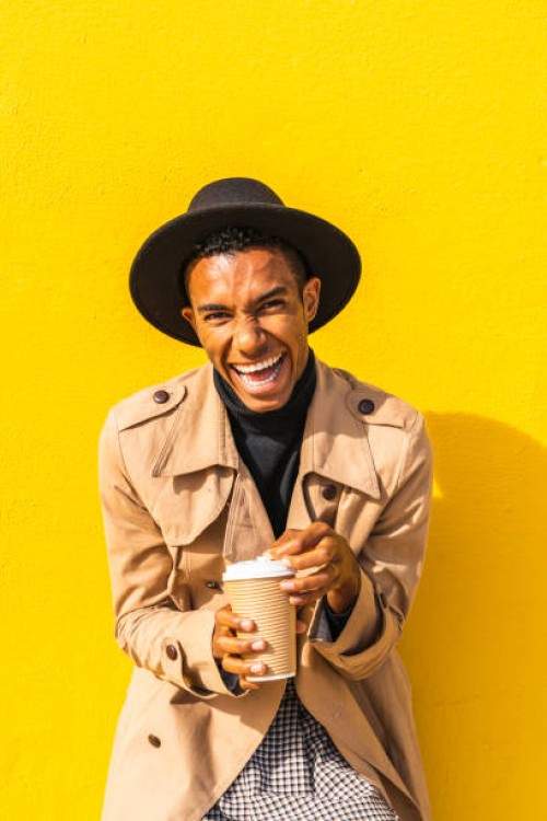 young man enjoying his take-out coffee - junk food stock pictures, royalty-free photos & images