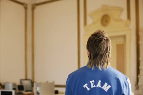 young man in an ornate room - hairstyle stock-fotos und bilder