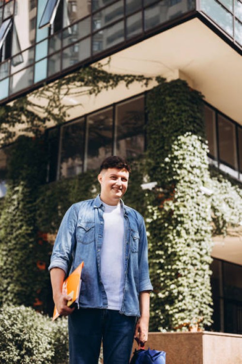 young man near building with living walls. - garden decoration stock pictures, royalty-free photos & images