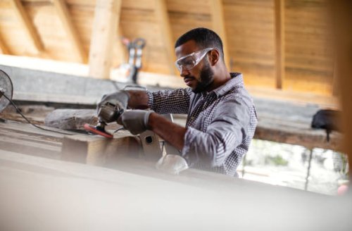 young man renovating the attic - home decoration stock pictures, royalty-free photos & images