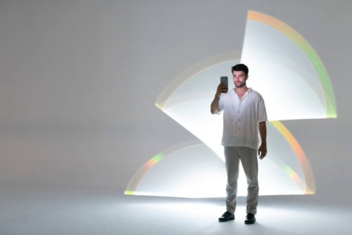 young man using a smart phone - fashion stock pictures, royalty-free photos & images