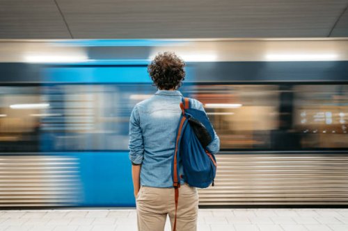 young man waiting for a subway train in stockholm - travel stock pictures, royalty-free photos & images