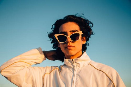 young man with cool attitude outdoor portrait - hairstyle stock pictures, royalty-free photos & images