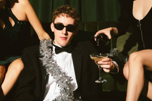 young man with ladies celebrating new year's eve - fashion stock pictures, royalty-free photos & images