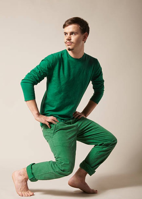 young man with moustache in green clothes - fashion stock pictures, royalty-free photos & images