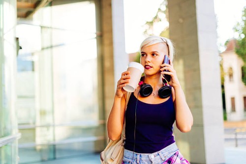 young northern european woman in city downtown - junk food stock pictures, royalty-free photos & images