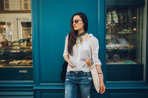 young parisian woman buying in a bakery - fashion stock pictures, royalty-free photos & images