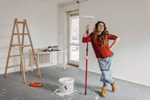 young pregnant woman painting nursery room - home decoration stock pictures, royalty-free photos & images