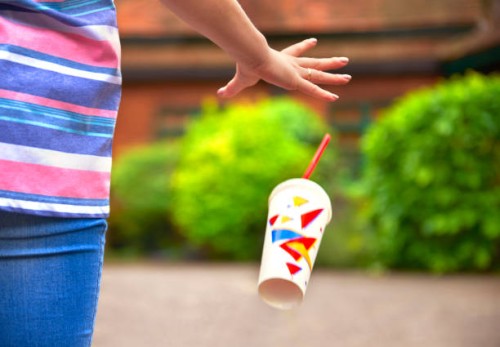 young student/teenager dropping litter - junk food stock pictures, royalty-free photos & images