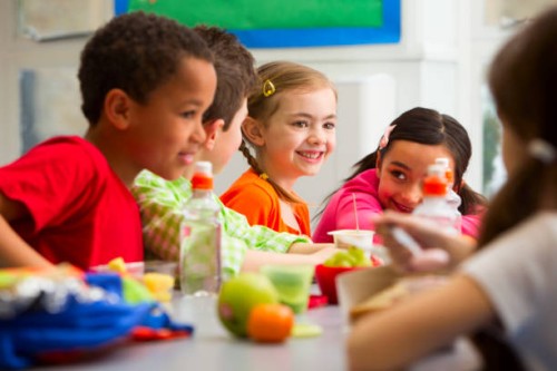 young students enjoying their lunch at school - food stock pictures, royalty-free photos & images