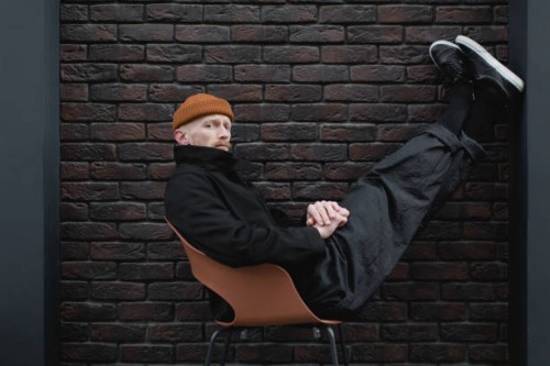 young stylish man in the black trendy outfit - fashion stock pictures, royalty-free photos & images