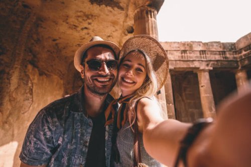 young tourists couple taking selfies at ancient monument in italy - travel stock pictures, royalty-free photos & images