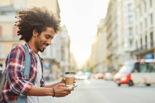 young trendy man in barcelona. - junk food stock pictures, royalty-free photos & images
