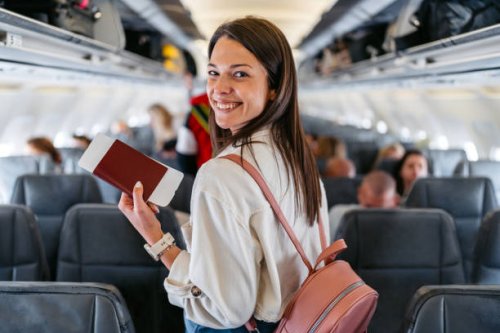 young woman boarding an airplane - travel stock pictures, royalty-free photos & images