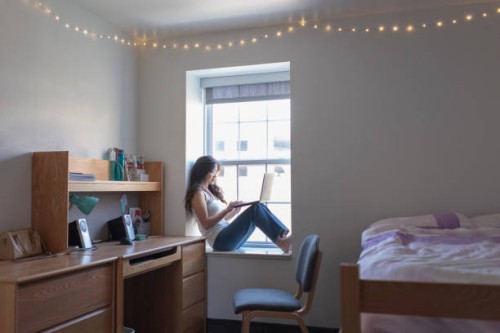 young woman college student in her dorm room with laptop - home decoration stock pictures, royalty-free photos & images