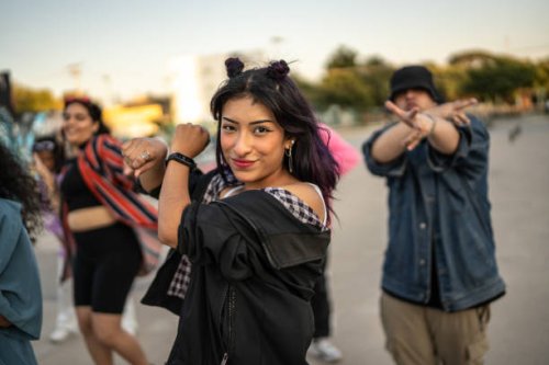 young woman dancing hip hop with her friends outdoors - concert stock pictures, royalty-free photos & images