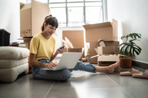 young woman doing an online shopping for new home - home decoration stock pictures, royalty-free photos & images