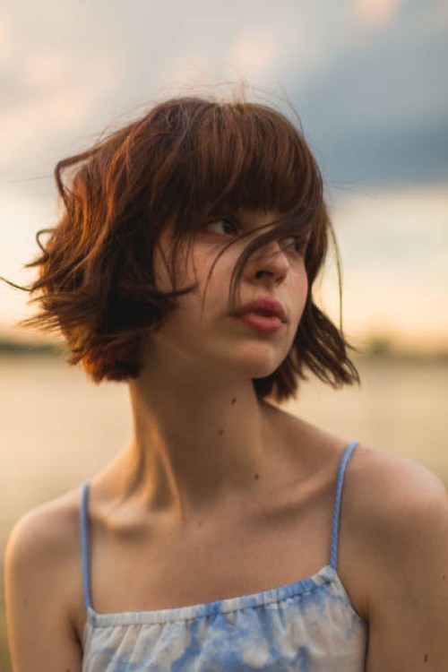 young woman enjoying sunset. - fashion stock pictures, royalty-free photos & images