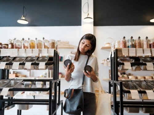 young woman holding jars in zero waste store - food stock pictures, royalty-free photos & images