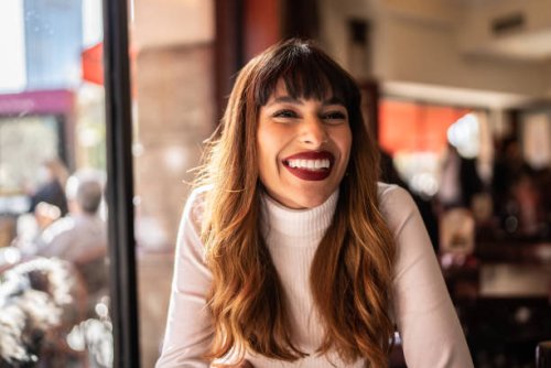 young woman in a cafeteria - hairstyle stock pictures, royalty-free photos & images