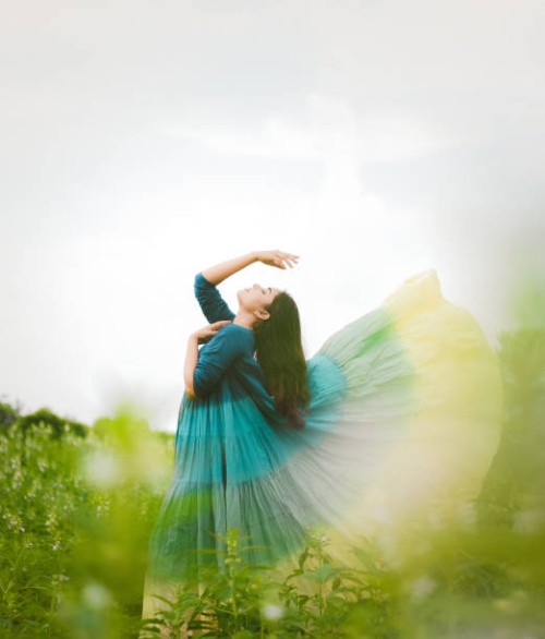 young woman in dress standing on field against sky,india - fashion stock pictures, royalty-free photos & images