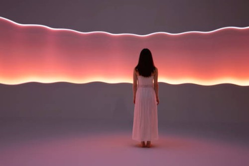 young woman in front of orange light trails - fashion stock pictures, royalty-free photos & images