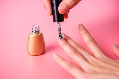 young woman painting nails with brush. making manicure - nails art stock pictures, royalty-free photos & images