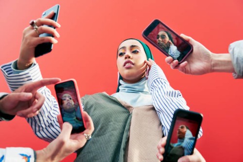 young woman surrounded by smartphones. - fashion stock pictures, royalty-free photos & images