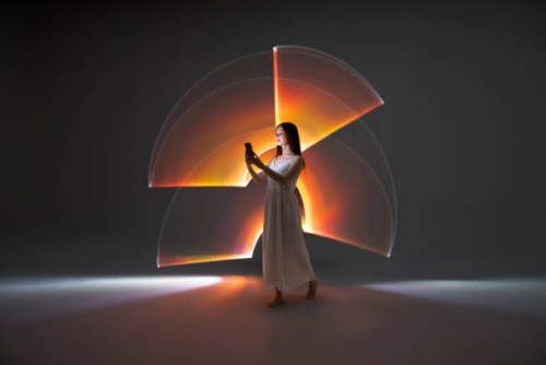 young woman using a smart phone - fashion stock pictures, royalty-free photos & images